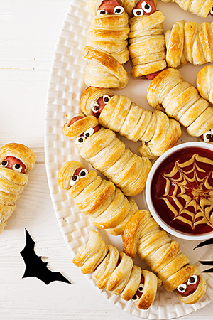 Hot dogs wrapped in pastry resembling mummys for Halloween-3B.png